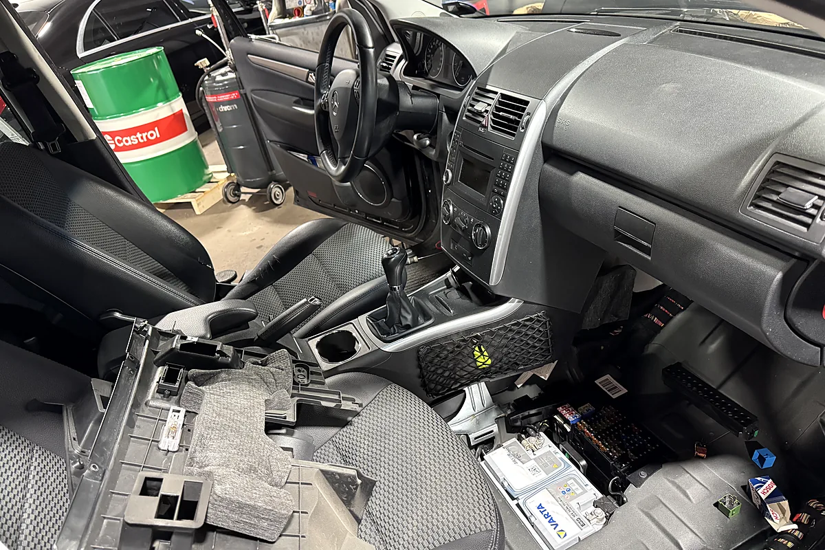 Interior trim removed to trace a fault in the vehicle electrics